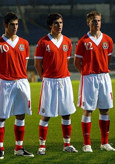 In which year did Aaron Ramsey make his full international debut for Wales?