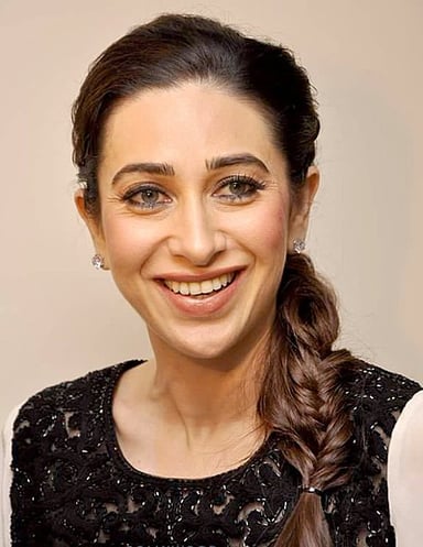Which movie marked Karisma Kapoor's acting debut?