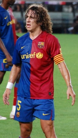 In which year did Carles Puyol make his debut for the Spanish national team?