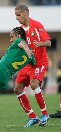 Against which team did Karim El Ahmadi score his first goal for Morocco?