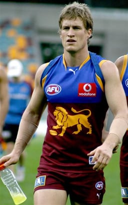 How many AFL grand finals did the Brisbane Lions appear in consecutively from 2001 to 2004?