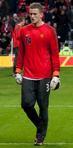How many caps did Lindegaard earn with the Denmark national team?