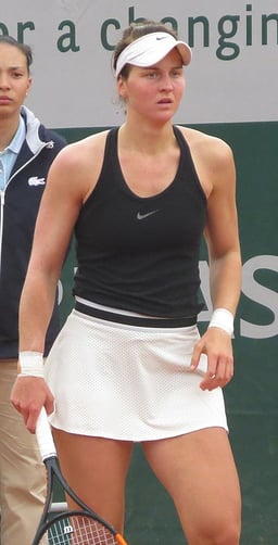 What are her highest career rankings in singles and doubles respectively?