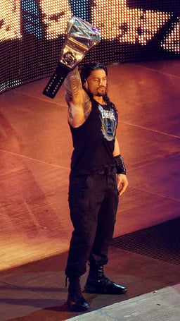 What is Roman Reigns's specialty in the world of sports?