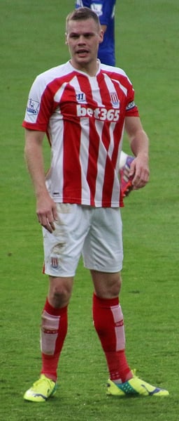 Who was Shawcross' partner at the centre-back position under Mark Hughes?