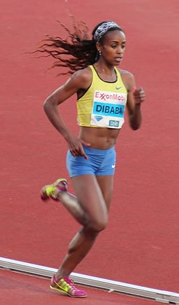 Which organization named Genzebe World Female Athlete of the Year in 2015?