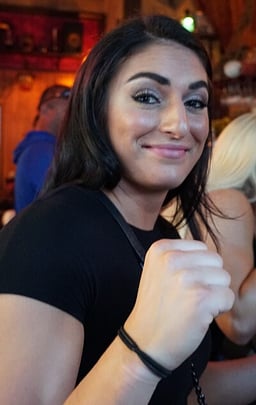 What is the name of Sonya Deville’s signature hair up style?