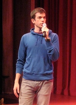 Which university did John Mulaney attend?