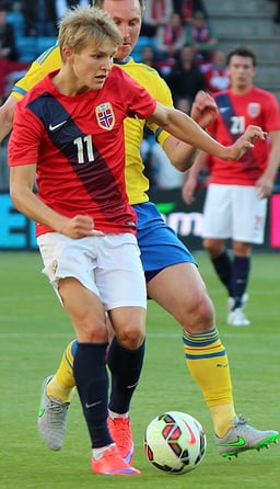 At what age did Ødegaard make his senior club career debut?