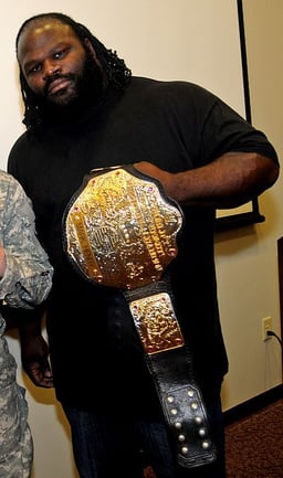 Which championship did Mark Henry win to become the fourth African-American world champion in WWE history?