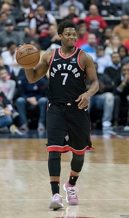 In which season did Lowry help the Raptors reach the playoffs after a six-year absence?