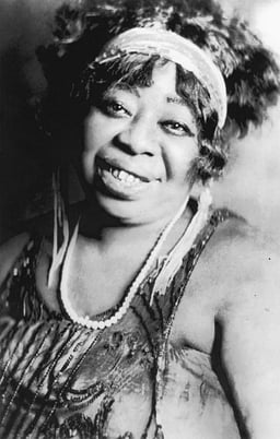 Which famous jazz musician played with Ma Rainey?