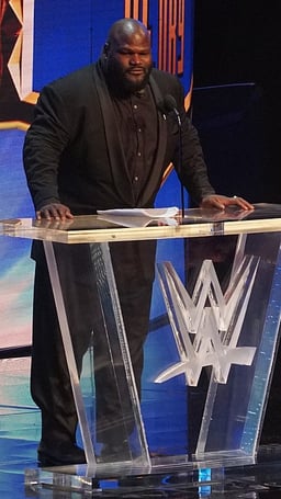 Which role does Mark Henry currently hold in All Elite Wrestling (AEW)?