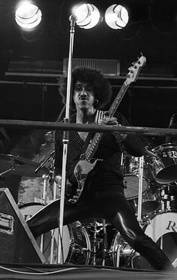 Thin Lizzy was known for combining Lynott's skills with what?
