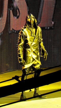 Under what ring name is Dustin Rhodes best known in the WWE?
