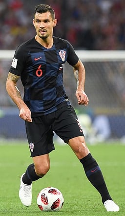 Which Ligue 1 club does Dejan Lovren currently play for?