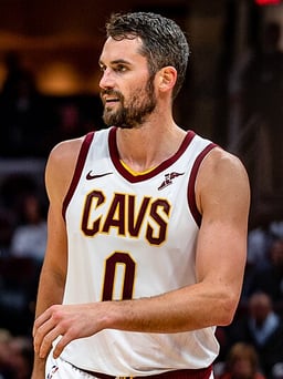 Which international basketball competitions has Kevin Love won gold medals in?