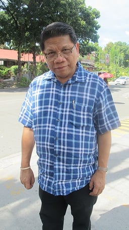 What is the name of the radio station Mike Enriquez was president of?