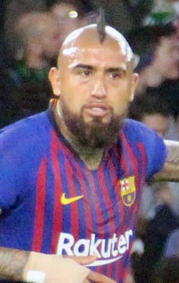 At which club is Vidal known as one of the best midfielders in world football?