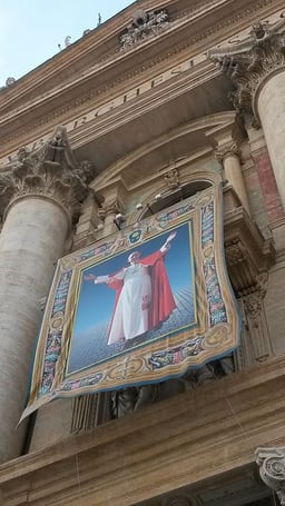 Which Pope elevated Giovanni Battista Montini to the College of Cardinals?