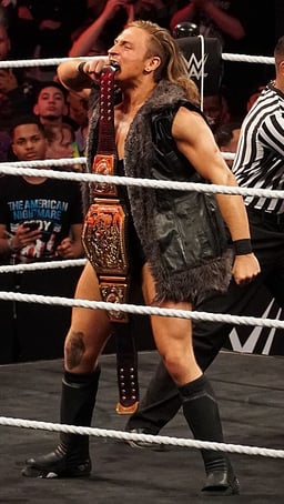 Which stable is Pete Dunne a member of in WWE?