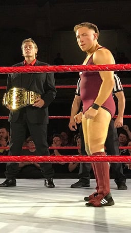 In which wrestling promotion did Dunne win the title of Progress World Champion?