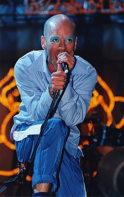 Michael Stipe's early "mumbling" singing style was later transformed into what?