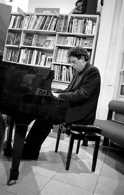 What organizations has Philip Glass been a part of?[br](Select 2 answers)