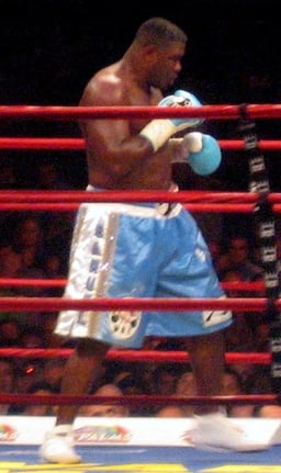 Who did Samuel Peter defeat to clinch the WBC heavyweight title?