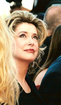 What profession is Deneuve known for apart from acting?