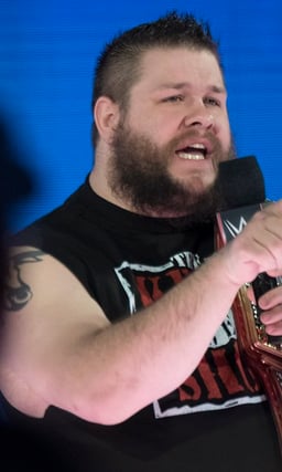 In which year did Kevin Owens sign with WWE?