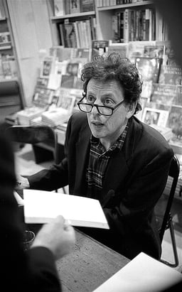What is Philip Glass's native language?