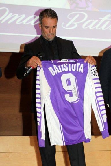 Before becoming a professional footballer, what sport did Batistuta play?