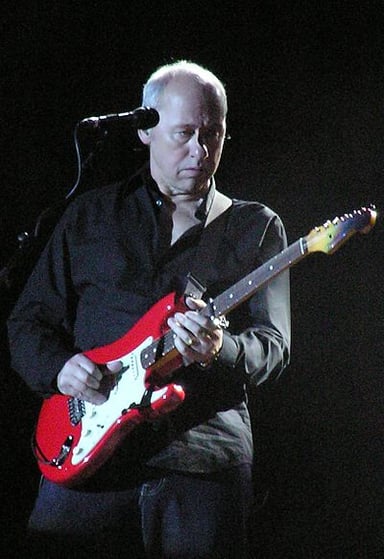 In which city was Mark Knopfler raised from the age of seven?