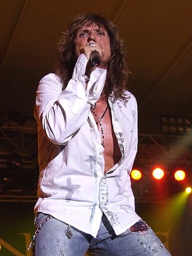What is David Coverdale's vocal range classified as?