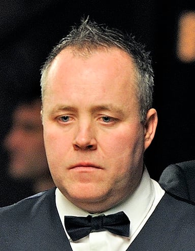 In which year did John Higgins win his most recent Triple Crown title?
