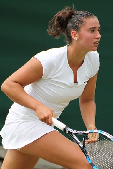 Where did she first win a match in a Grand Slam tournament?