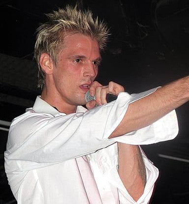 Which famous boy band is Aaron Carter's brother Nick a member of?