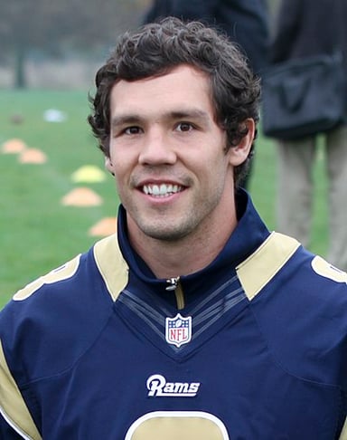 Which university offered Sam Bradford a scholarship out of high school?