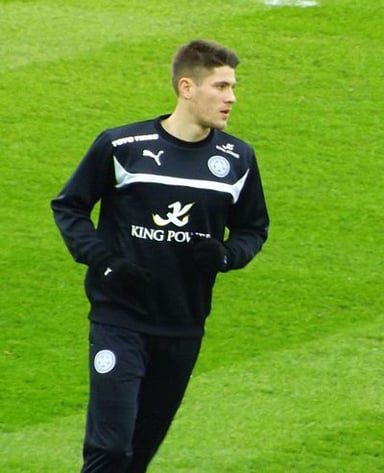 What position does Andrej Kramarić primarily play in football?