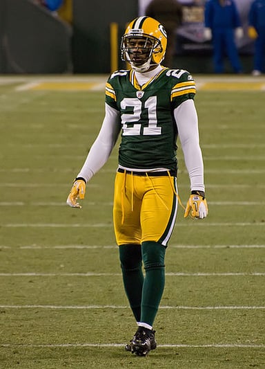 What was the jersey number of Charles Woodson in the NFL?