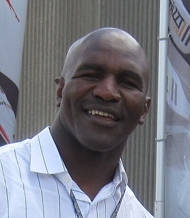 What year was Evander Holyfield inducted into the International Sports Hall of Fame?