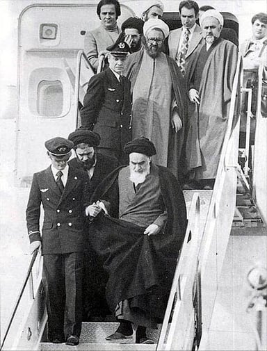How many years did Khomeini spend in exile?