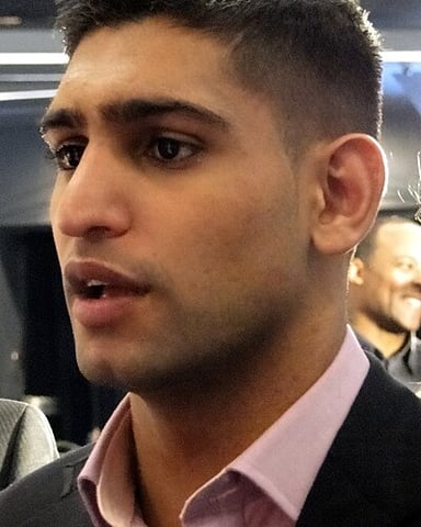 What is the name of Amir Khan's charity organization?