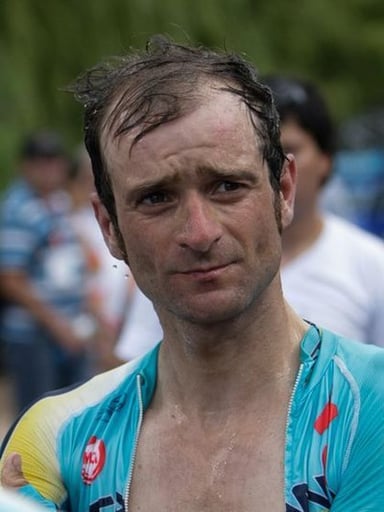 When was Scarponi suspended from racing until August 2008?