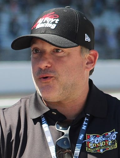 What car number did Tony Stewart drive for Joe Gibbs Racing from 1999 to 2008?
