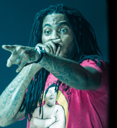 What was the name of the label Waka Flocka Flame was initially signed to?