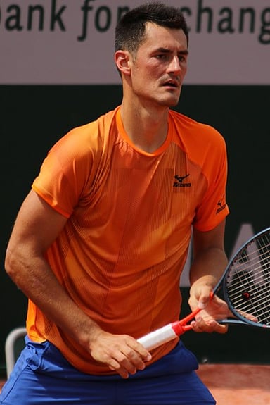 At which major tournament did Tomic make a quarterfinal appearance in 2011?