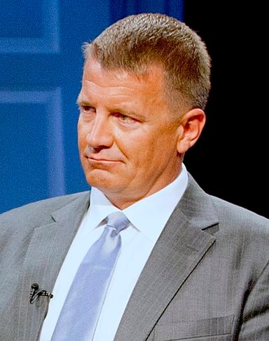 How is Erik Prince related to former U.S. Secretary of Education Betsy DeVos?