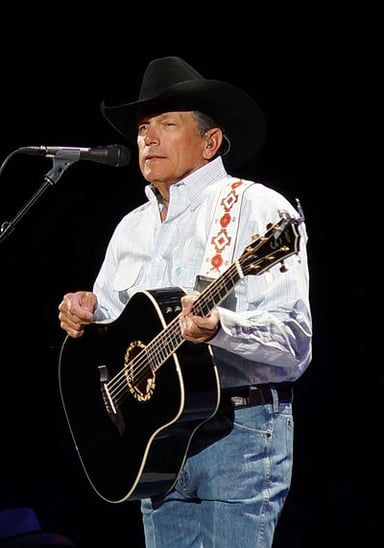 How many times has George Strait won CMA Entertainer of the Year?